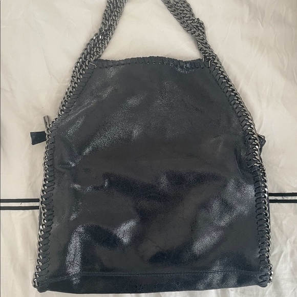 Handbags - Navy blue shoulder bag with silver hardware.